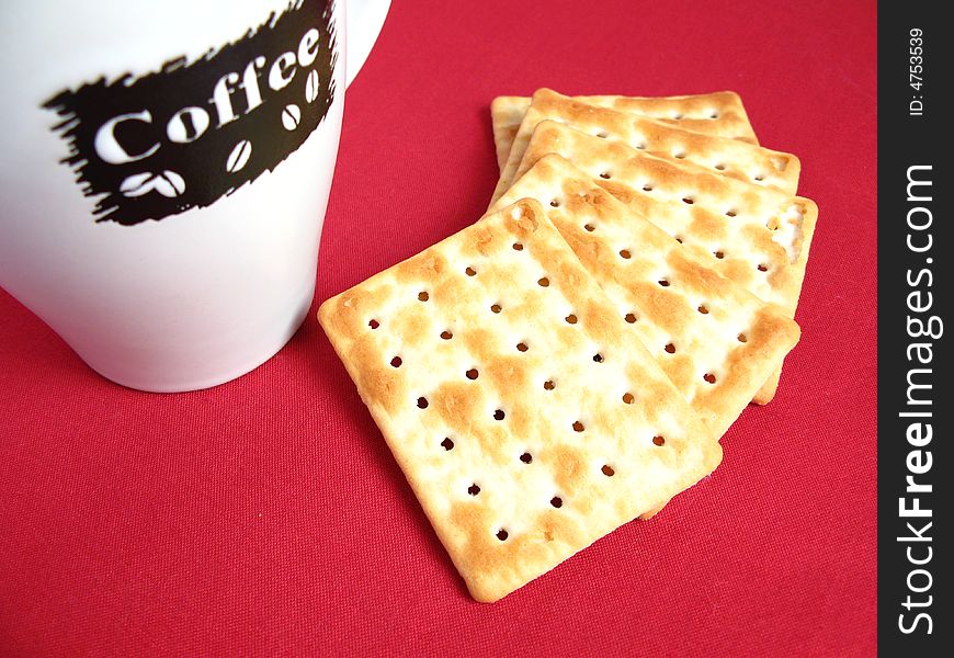 Coffee with crackers in red background. Coffee with crackers in red background.