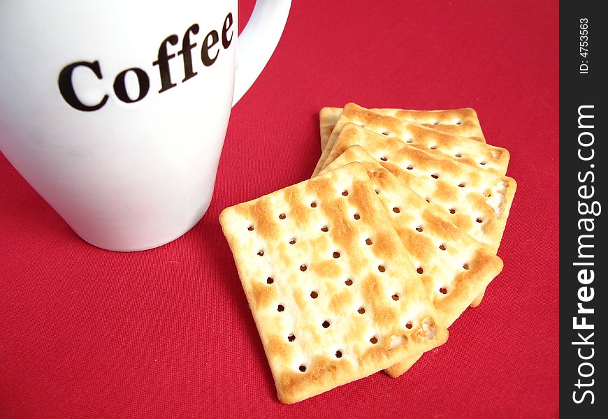 Coffee with crackers in red background. Coffee with crackers in red background.