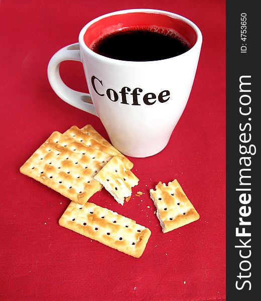 Coffee with crackers in red background. Coffee with crackers in red background.