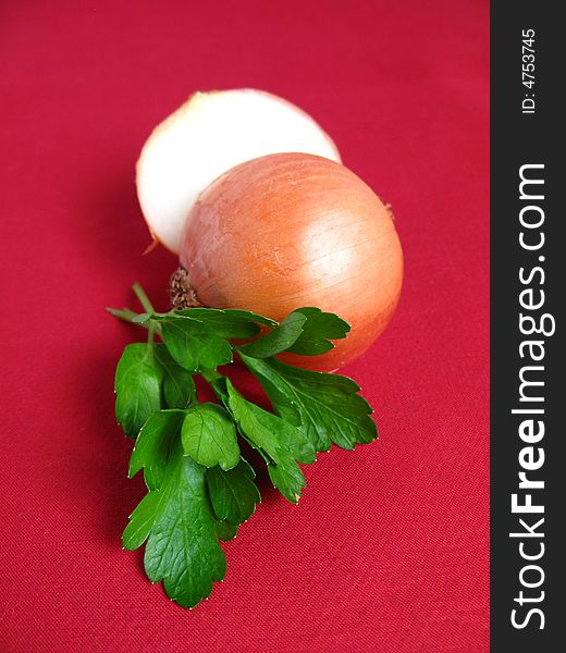Bouquet of parsley tied with a white rope, Onion and Garlic, in red background. Bouquet of parsley tied with a white rope, Onion and Garlic, in red background.