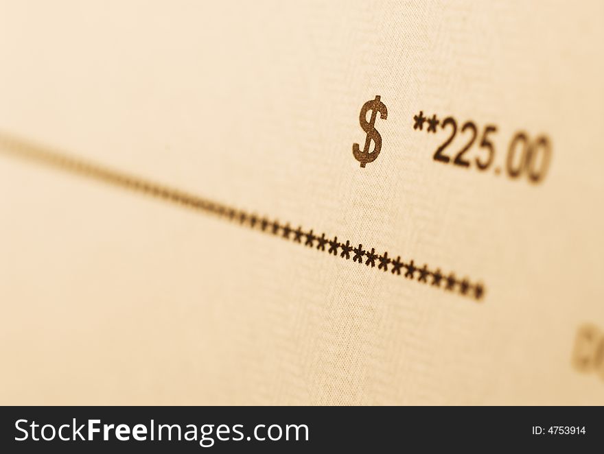 A check with amount in focus. A check with amount in focus.