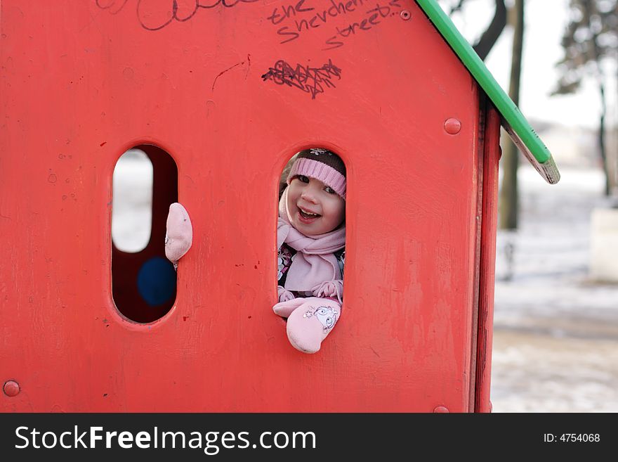 Girl play hide-and-seek at playground