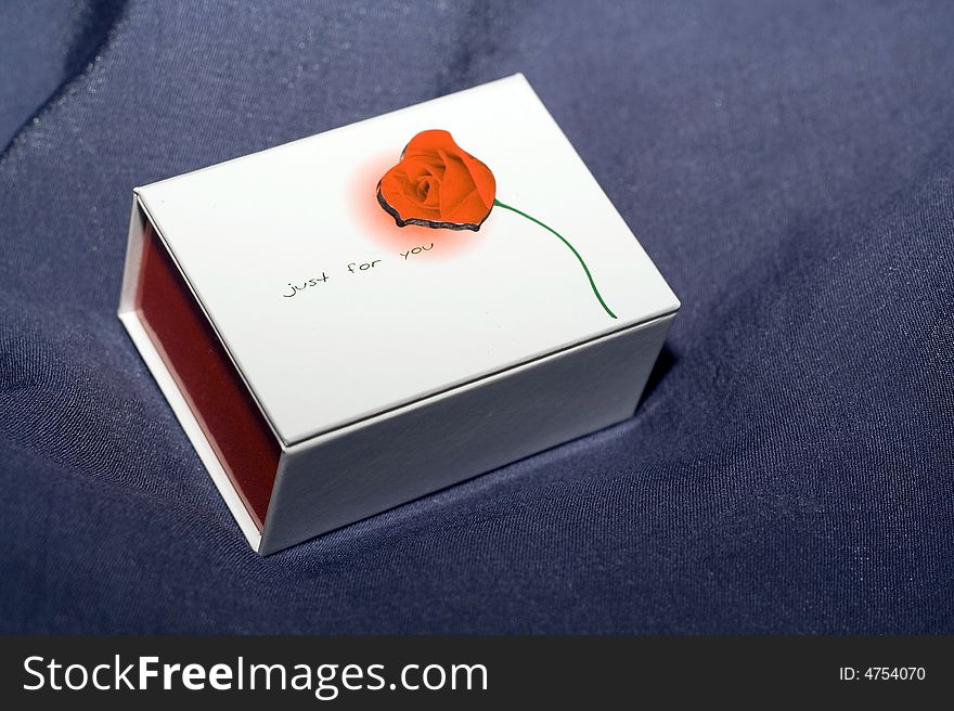 Nice ring gift box with red rose on it.