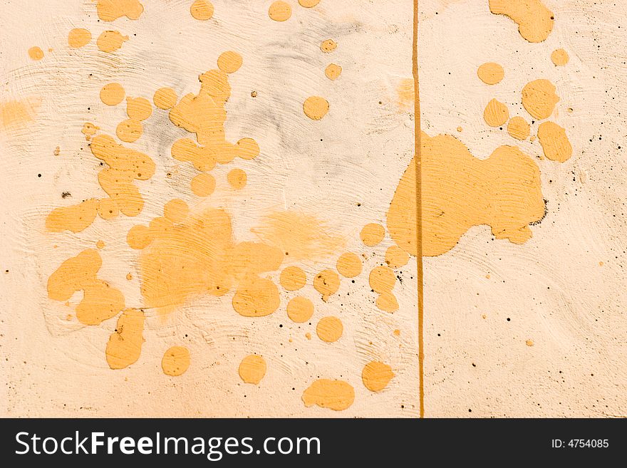 Yellow - orange plastered wall pattern