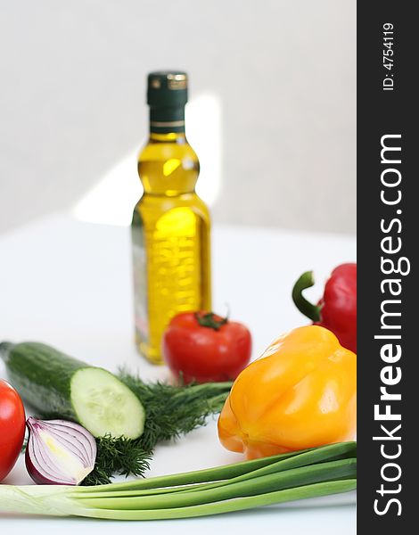 Multi-coloured vegetables for salad on a white background