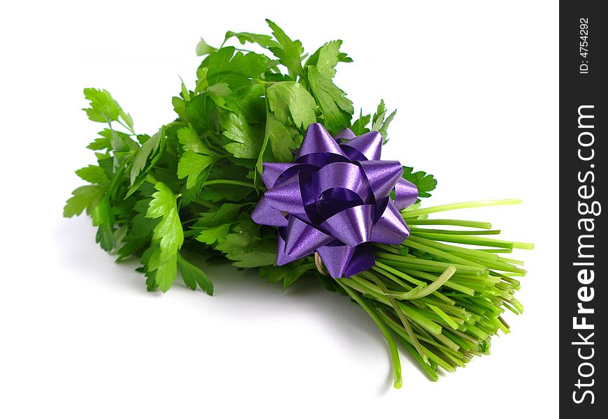 Bouquet of parsley tied with a bow, in white background.