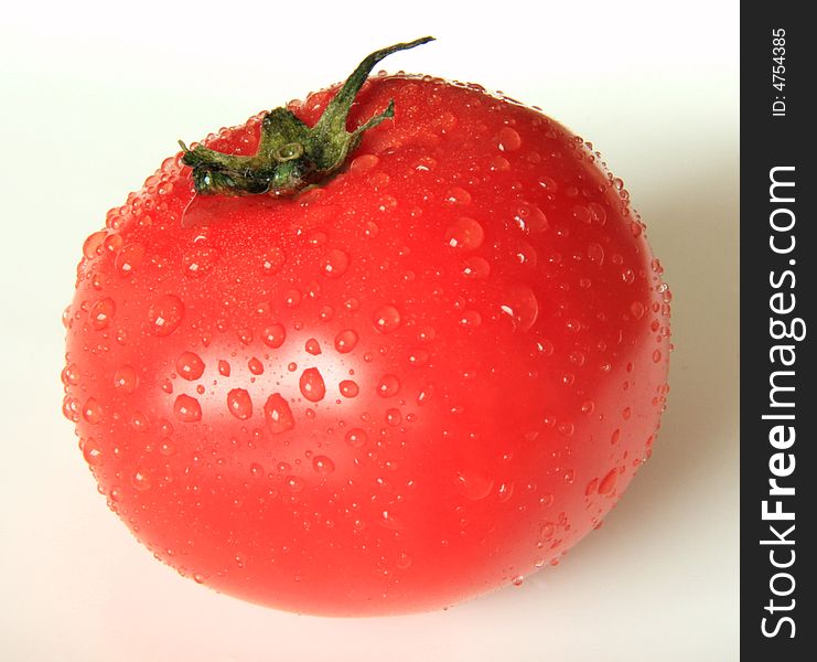 A photograph of a fresh tomato.