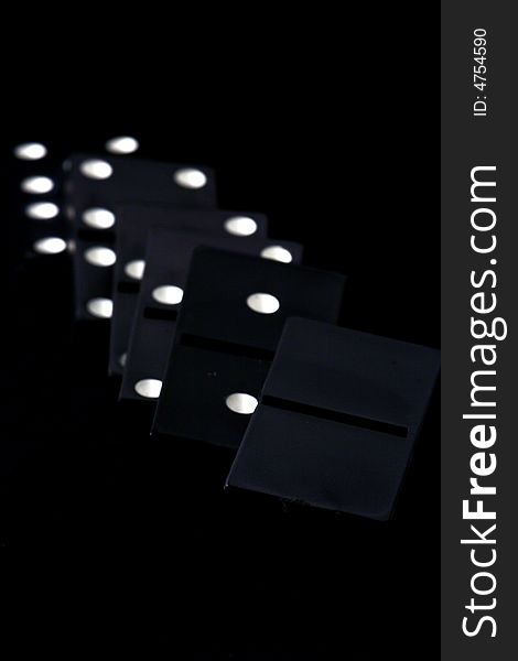 Dominoes isolated in dark background