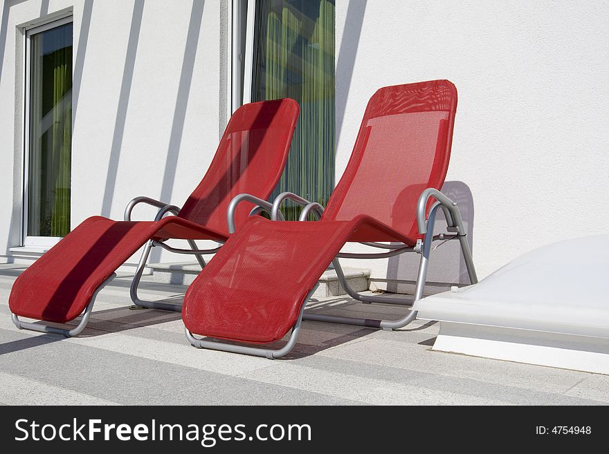 Red couch to relax on a sunny terrace. Red couch to relax on a sunny terrace