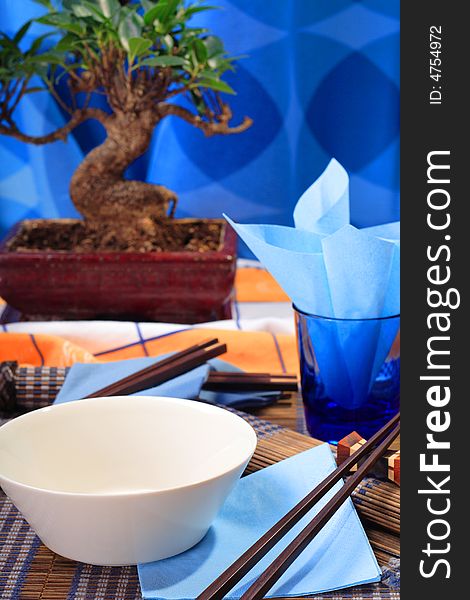 Asian decorated table, soup bowl in the foreground