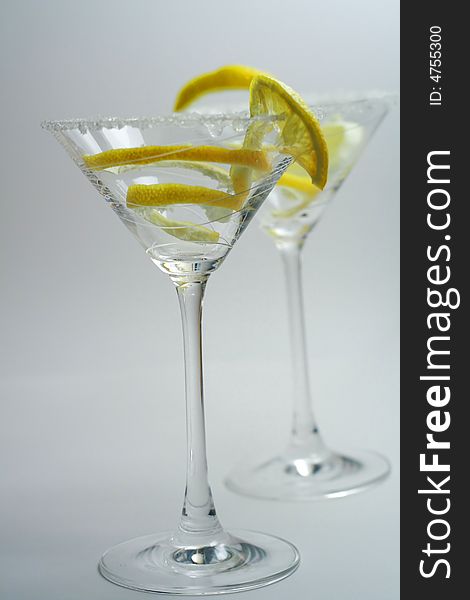Martini drinks with sugar crust and lemon closeup