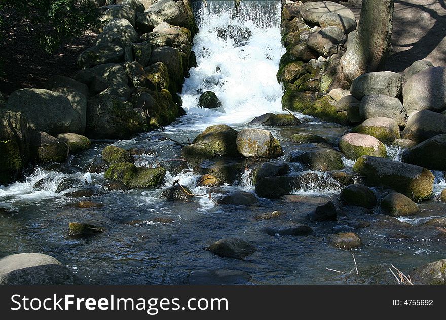 Beautiful waterfall in park on a sunny day