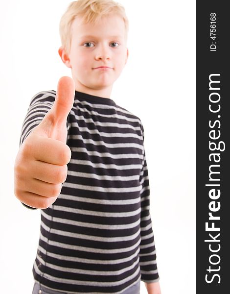 Portrait of a smiling little boy, thumbs up