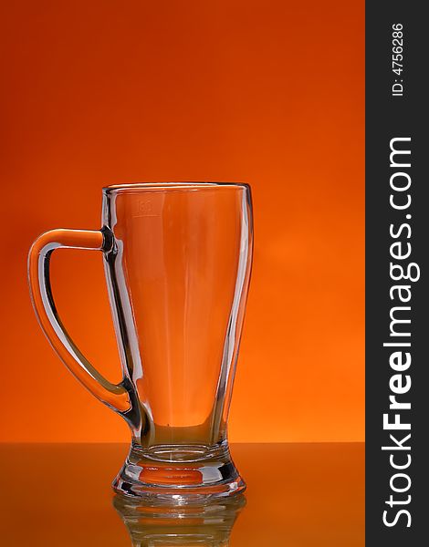 Empty mug over orange background. Empty mug over orange background