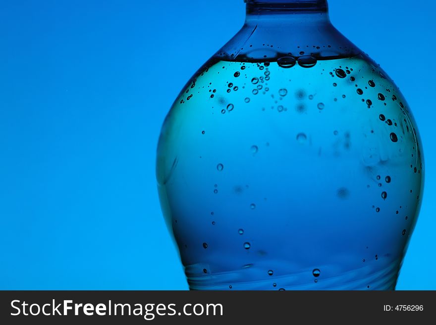 Mineral Water Bottle On Blue Background
