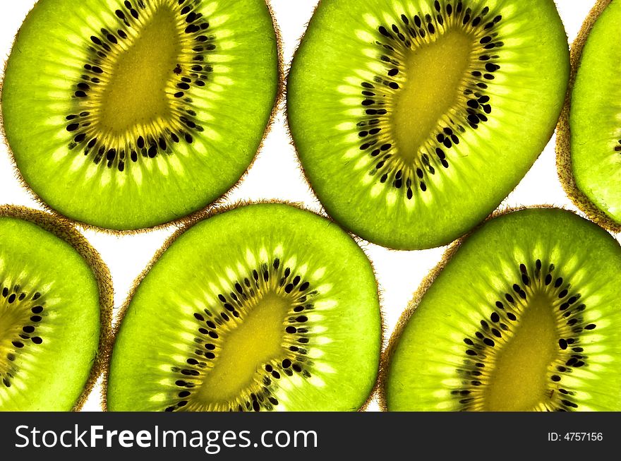 Kiwi fruit slices on white backround