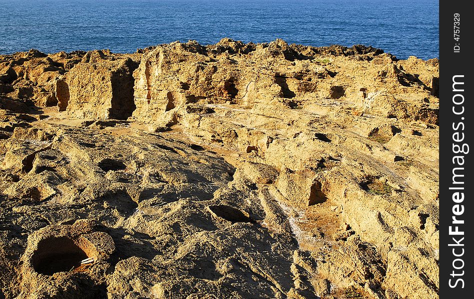 Holes and shapes on the cliff next to the sea in Crete. Holes and shapes on the cliff next to the sea in Crete