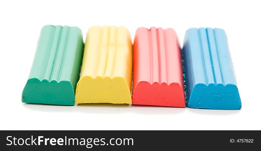 Close up of four clay blocks on white background