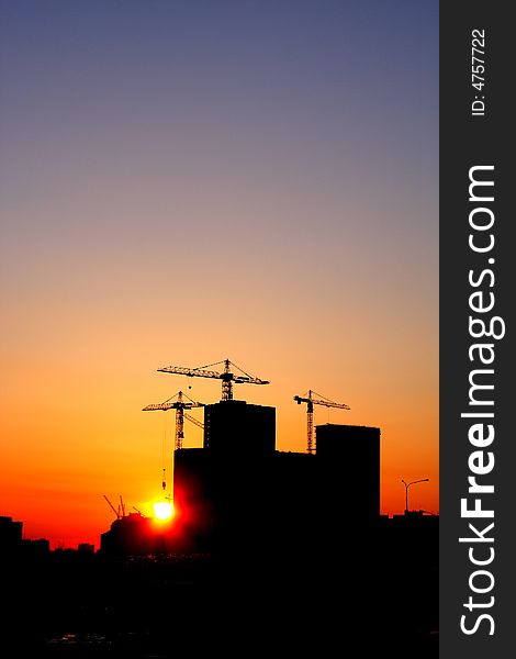 Construction of a major housing project at sunset. Construction of a major housing project at sunset.