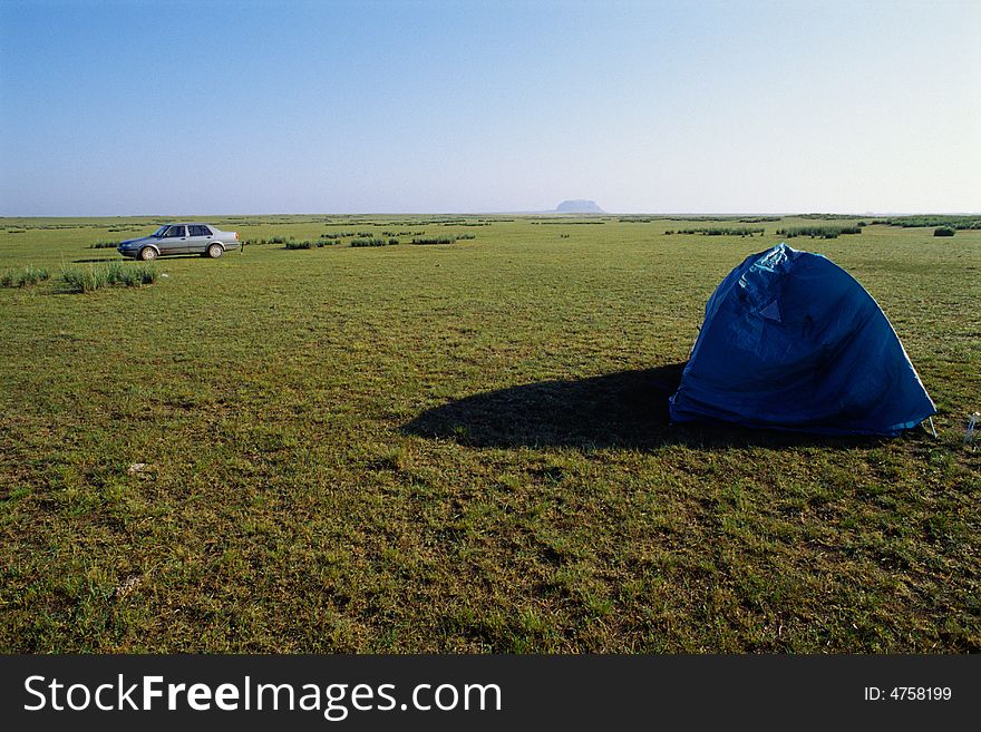 Blue tent and car, moring sunlight in mongolia plateau, china