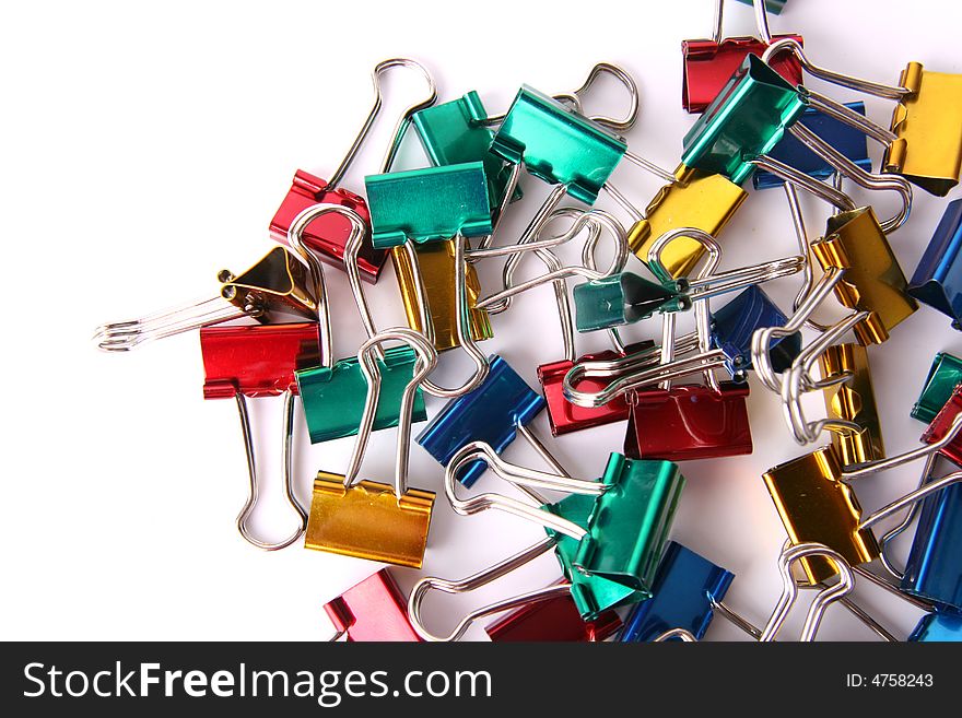 Textured background of colored paper clips