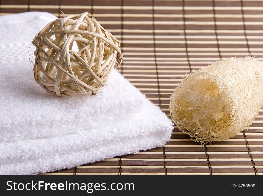 Sphere, natural sponge and two white towels. Sphere, natural sponge and two white towels