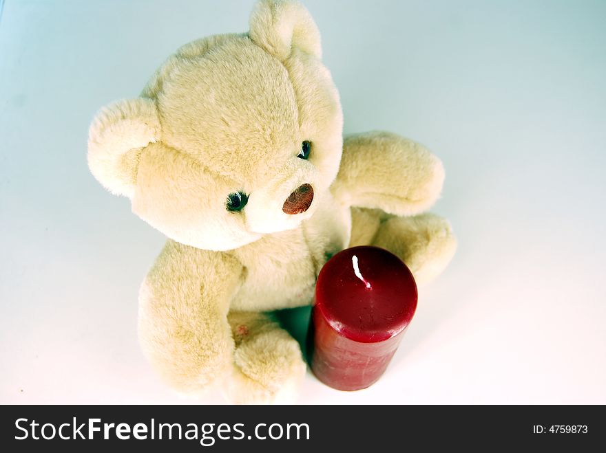 Teddy-bear And Unlit Candle
