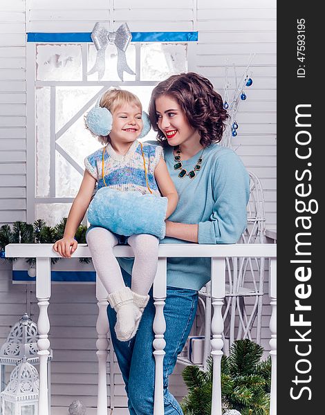 Smiling Little Girl With Her Older Sister Standing Next To A Chr