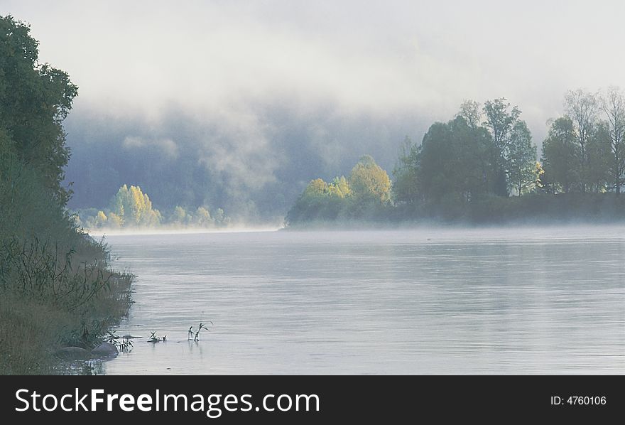 The river in the morning in fog. Photo.