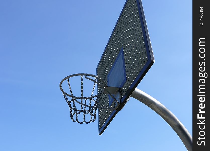 Steel basket to basket-ball on blue sky