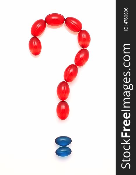 Question mark made of red and blue capsules on white background. Question mark made of red and blue capsules on white background