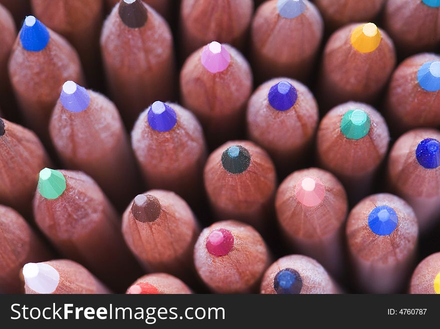 Full frame view of coloured pencils in pot