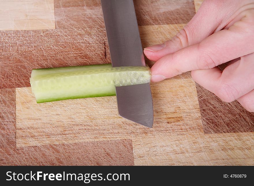 Cutting the cucumber with a knife