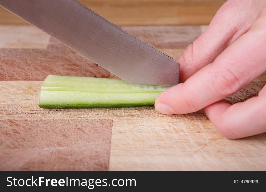 Cutting the cucumber with a knife