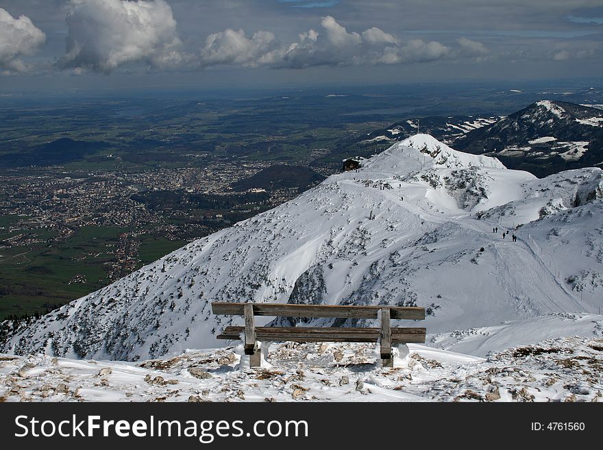 Wooden bench on mountain top over Salzburg city. Wooden bench on mountain top over Salzburg city.