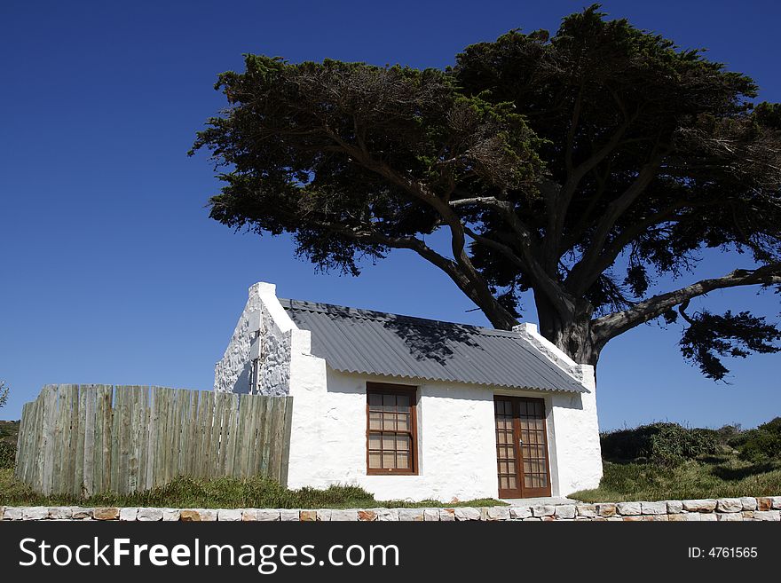 Small white house near buffelsfontein visitors centre within the table mountain national park near the cape of good hope cape town western cape province south africa