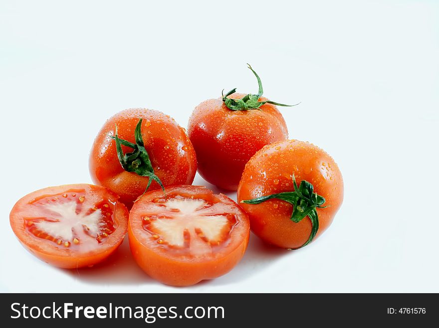 Tomato and slice on white background. Tomato and slice on white background