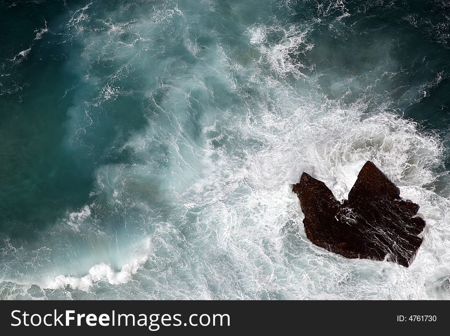 Looking down onto a single rock along the coastline of cape point table mountain national park cape town western cape province south africa