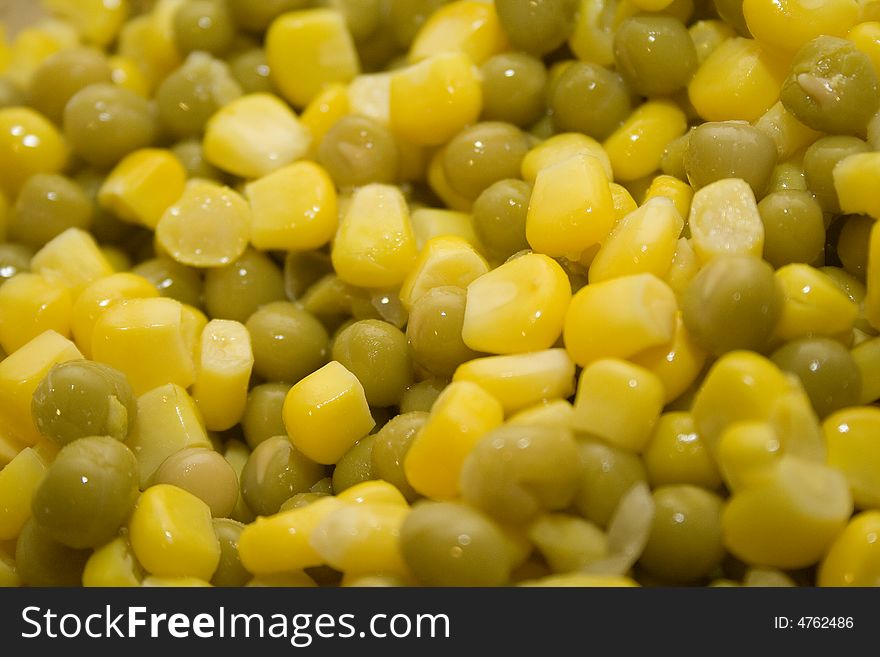 Sweet yellow corn and green pea background. macro shot. Sweet yellow corn and green pea background. macro shot.