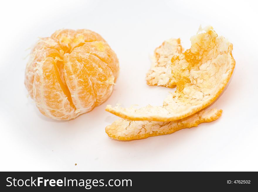 Peeled mangarin on white background