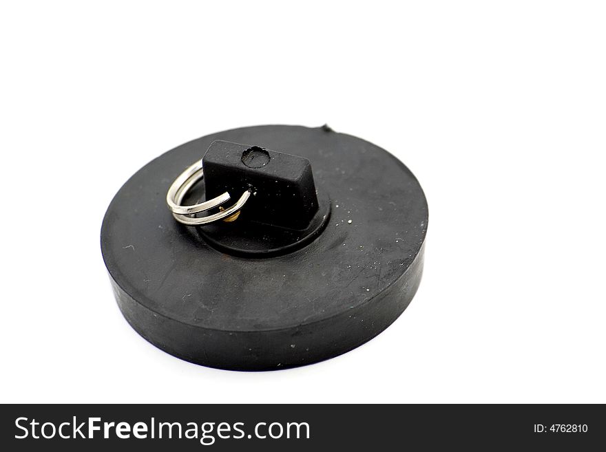 Close-up of black rubber plug isolated on white.