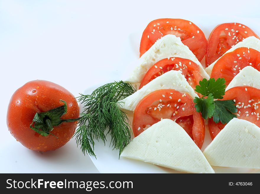 Tomato and slice on white background. Tomato and slice on white background