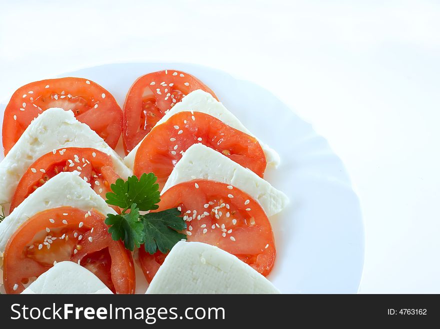 Tomato and cheese on white background. Tomato and cheese on white background