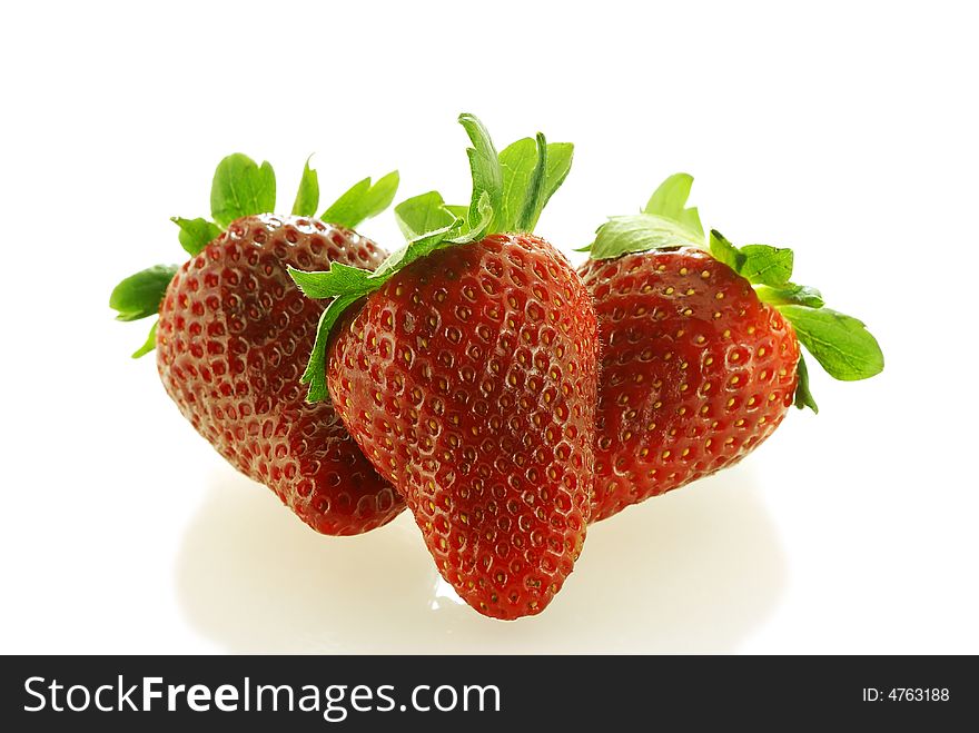 Tree fresch ripe strawberries over white background