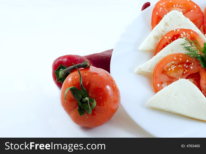 Red Tomatoes and paprika on white background. Red Tomatoes and paprika on white background