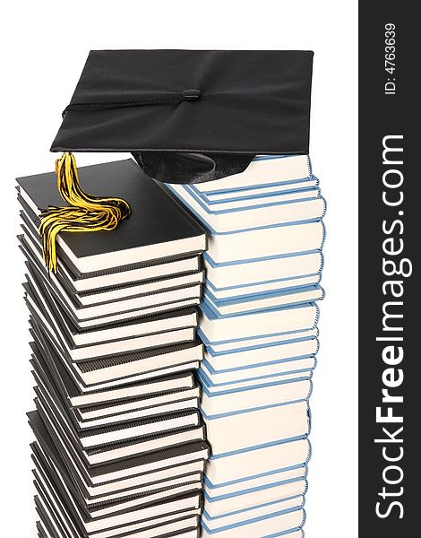 Graduation cap and books on white background