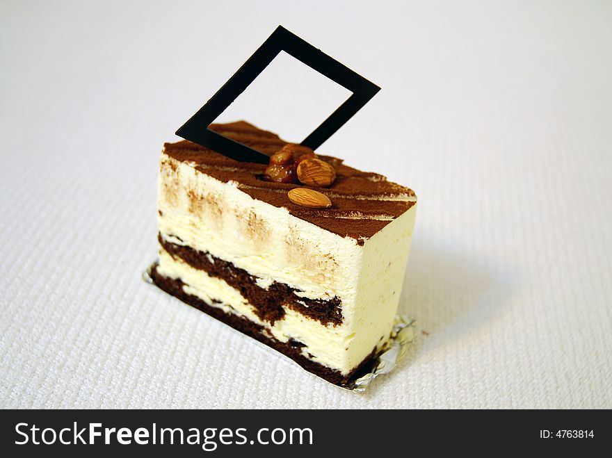 Sweet tiramisu with coco, chocolate, apricot kernel & walnut kernel