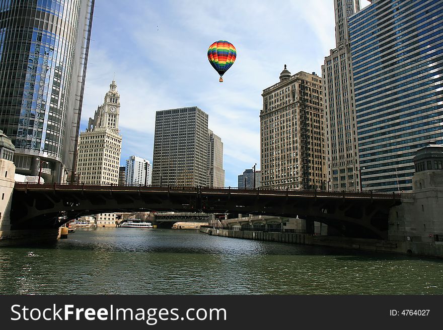 Hot air balloon above high-rise buildings in downtown Chicago. Hot air balloon above high-rise buildings in downtown Chicago.