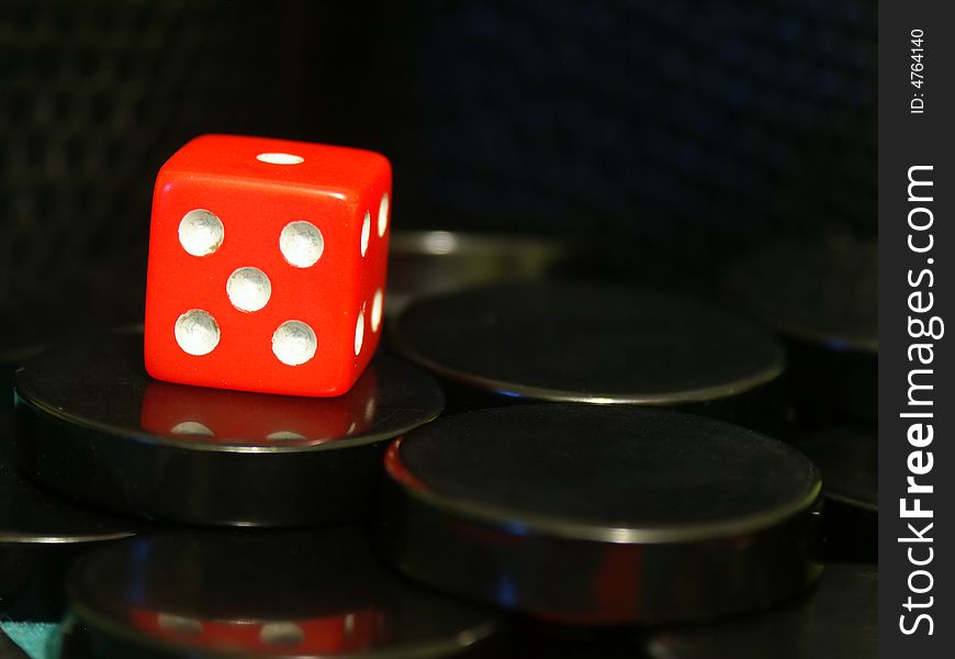 A cube used to play backgammon game. A cube used to play backgammon game