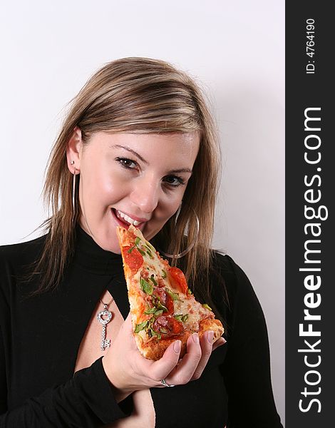 sweet girl eating pizza slice